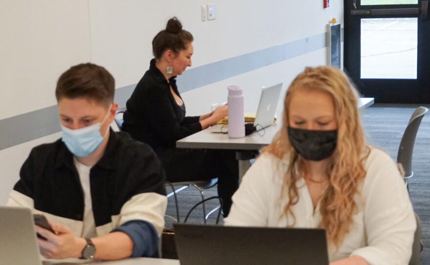 Attorneys and volunteers with the Tap In Center work on cases at the Florissant Valley branch of the St. Louis County Library on April 12, 2022. A second center opened at the Lewis and Clark branch this month.