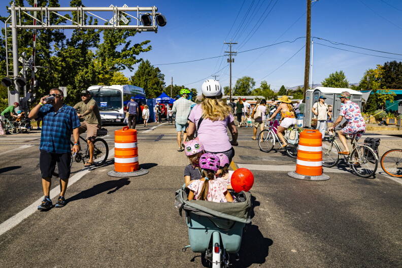 Cyclists and pedestrians take over Latah near the railroad crossing.