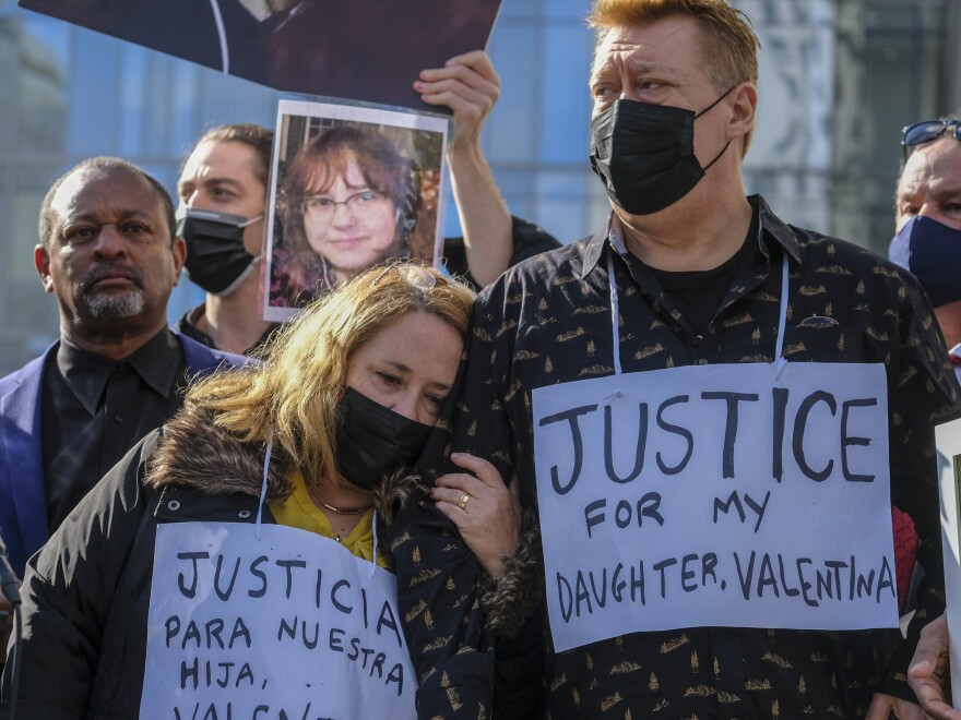 The parents of Valentina Orellana-Peralta, a 14-year-old girl killed by a stray bullet fired by an LAPD officer at a North Hollywood clothing store, and their attorneys hold a news conference on Dec. 28, 2021.