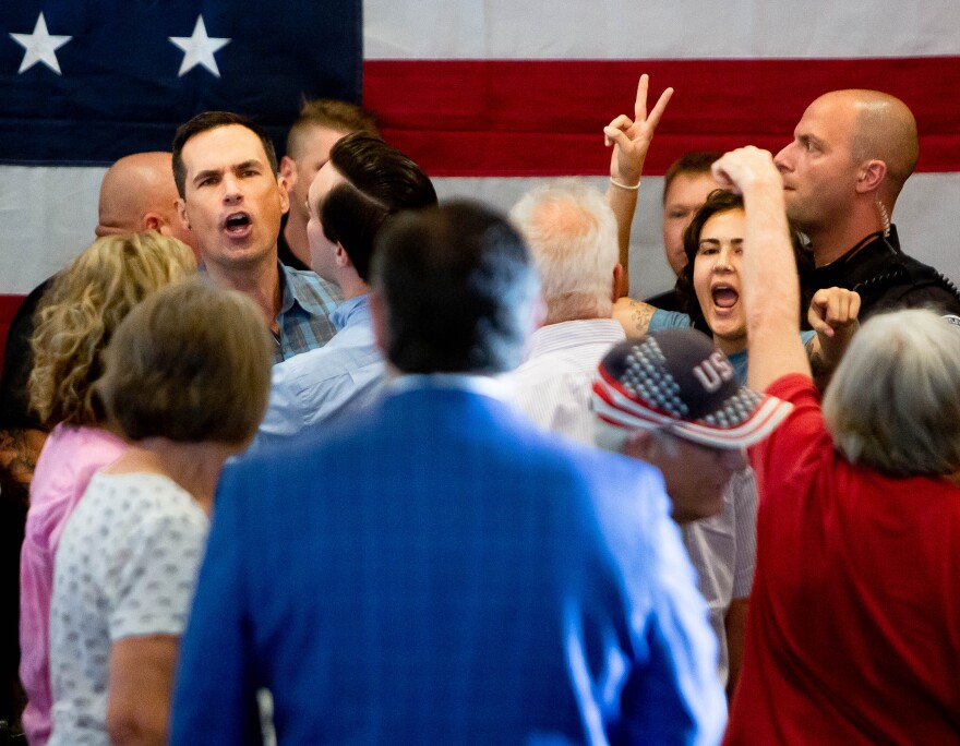 Protestors scream out “blood is on your hands” to Senator Ted Cruz (R-Texas) as they're removed by police on Saturday, July 23, 2022, during a Rally for Missouri fundraising event at Piazza Messina in Cottleville.