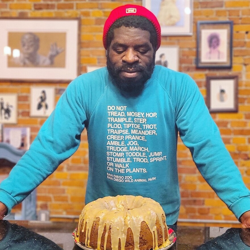 Hanif Abdurraqib and a Bundt cake he made.