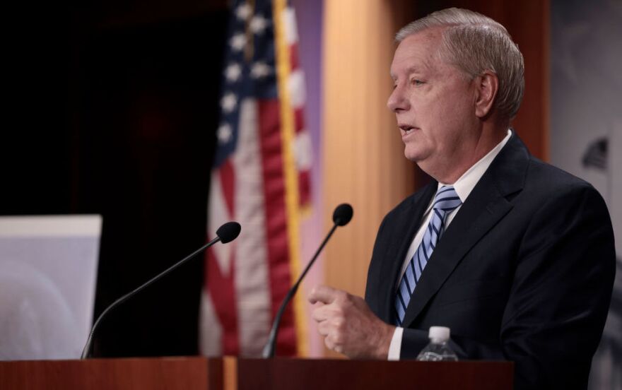 Sen. Lindsey Graham, R-S.C., speaks at a press conference in December 2021 in Washington, D.C. Comments by Graham about Russian President Vladimir Putin have drawn criticism from other lawmakers.