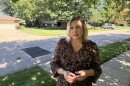 Ukrainian immigrant Tetiana stands on her street in Kettering, Ohio, discussing her struggles staying safely in the U.S. while her hometown suffers through war with Russia
