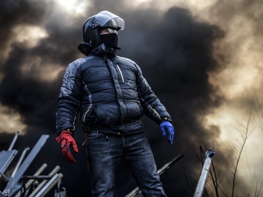 Even as word was emerging about a possible end to the crisis, anti-government protesters remained in Kiev's Independence Square early Friday.