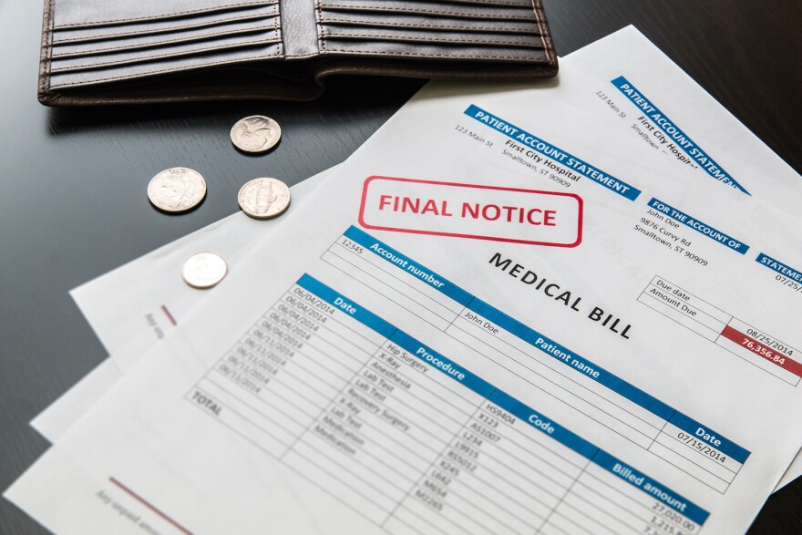 Medical bill from the hospital, concept of rising medical cost, selective focus. All data on the bill and form design are fictional, created specially for this concept.