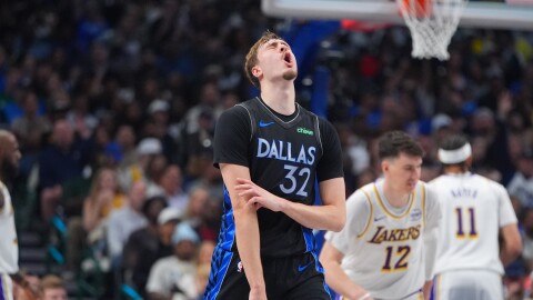 Dallas Mavericks forward Cooper Flagg (32) reacts to a score during the first half of an NBA basketball game against the Los Angeles Lakers in Dallas, Sunday, April 5, 2026.