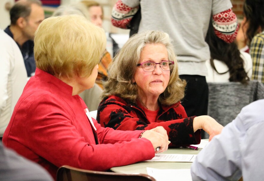 Women speak at table