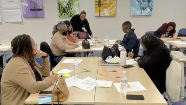 Attendees at a Queens Village Dayton co-design session work on a plan to support the health of local women and infants.