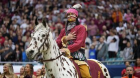 Florida State Seminoles mascot Chief Osceola rides Renegade during the playing of the national anthem at the start of the Orange Bowl NCAA college football game against Georgia, Saturday, Dec. 30, 2023, in Miami Gardens, Fla.