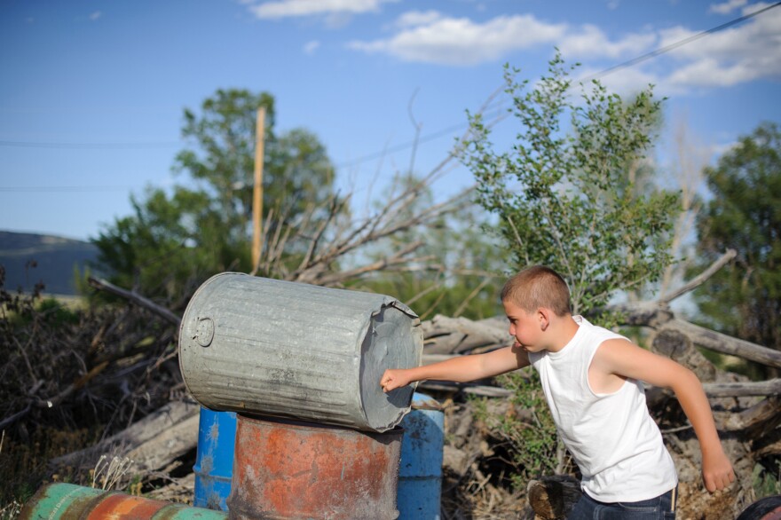 Vinny punches a trashcan behind his aunt's home in northern New Mexico. Juvenile Court ordered that he live with his paternal aunt after his release from juvenile detention. He was incarcerated at age 13 for stabbing his mother's assailant.