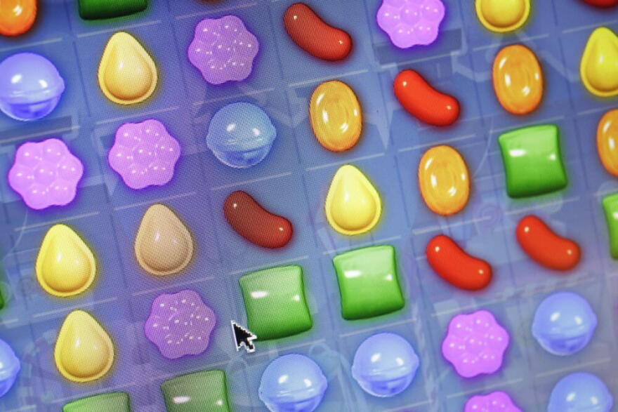 This Monday, March 24, 2014, file photo shows a detail from the online game "Candy Crush Saga" on a computer screen in New York. (Mark Lennihan/AP)