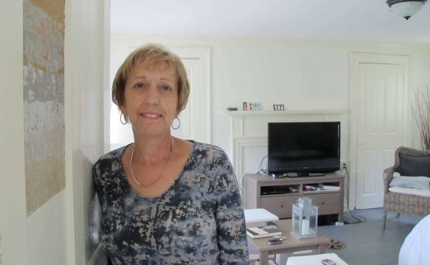 Eva Boice moved to Strawbery Banke from New York to be closer to her family. A retired social studies teacher, she appreciates the nuances of her new home, like the mismatched paint on her door panel. During renovations, contractors uncovered paint layers dating to the early 1800s.