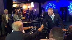 Mayor Buddy Dyer greets a supporter at his re-election launch party at the Abbey in downtown Orlando. Photo: Emily Lang, WMFE
