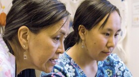 Two women look ahead