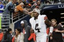 Cleveland Browns quarterback Deshaun Watson (4) arrives on the field before a preseason NFL football game against the Seattle Seahawks, Saturday, Aug. 24, 2024, in Seattle.