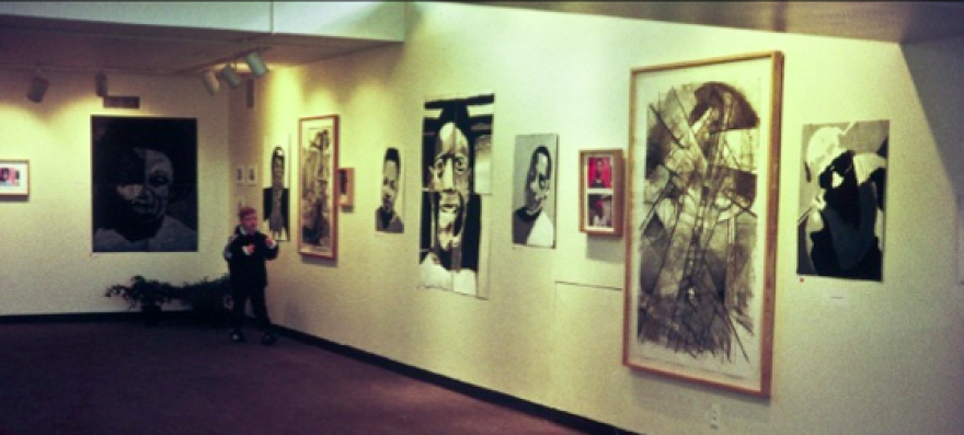 A previous City Faces exhibit includes self portraits and one of Hansman's worked, which is the large framed piece.