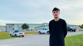 Feraidon Hakimi, wearing Afghan clothes, stands outside Fort Pickett military base in Blackstone, Va. in October 2021. Hakimi spent four months on the base before moving to Maryland.