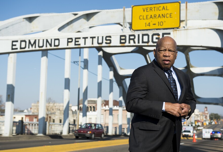 The late Rep. John Lewis stands on the Edmund Pettus Bridge in Selma, Ala., in 2015, where he was beaten by police on "Bloody Sunday."