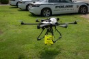 A drone carrying a defibrillator lifts off as part of a demonstration of the technology.