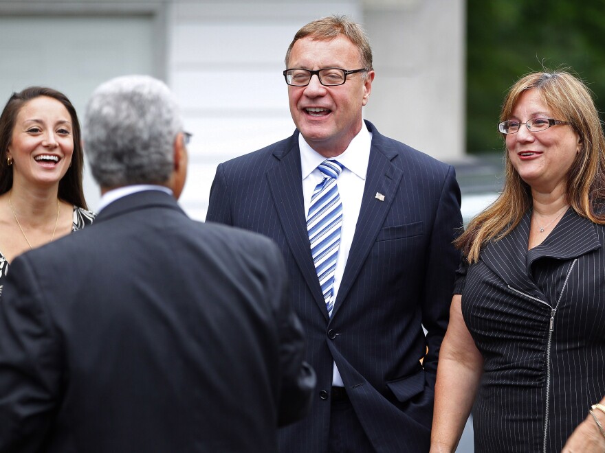 Republican Steve Lonegan (center) greets a supporter with his daughter Brooke and wife, Lorraine, after voting in the special Republican primary Tuesday in Bogota, N.J.