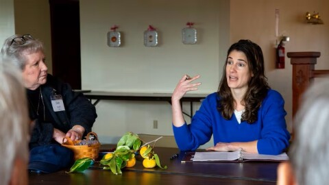 Rep. Marie Gluesenkamp Perez speaks with residents of Vista Del Rio manufactured home park on Oct. 22, 2025.