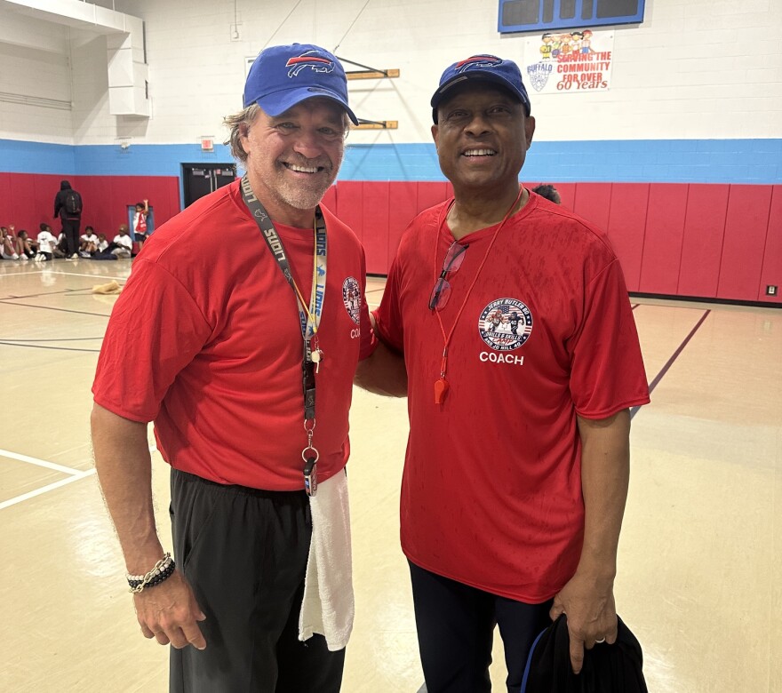 Mark Schmidt and Jerry Butler at the football camp.