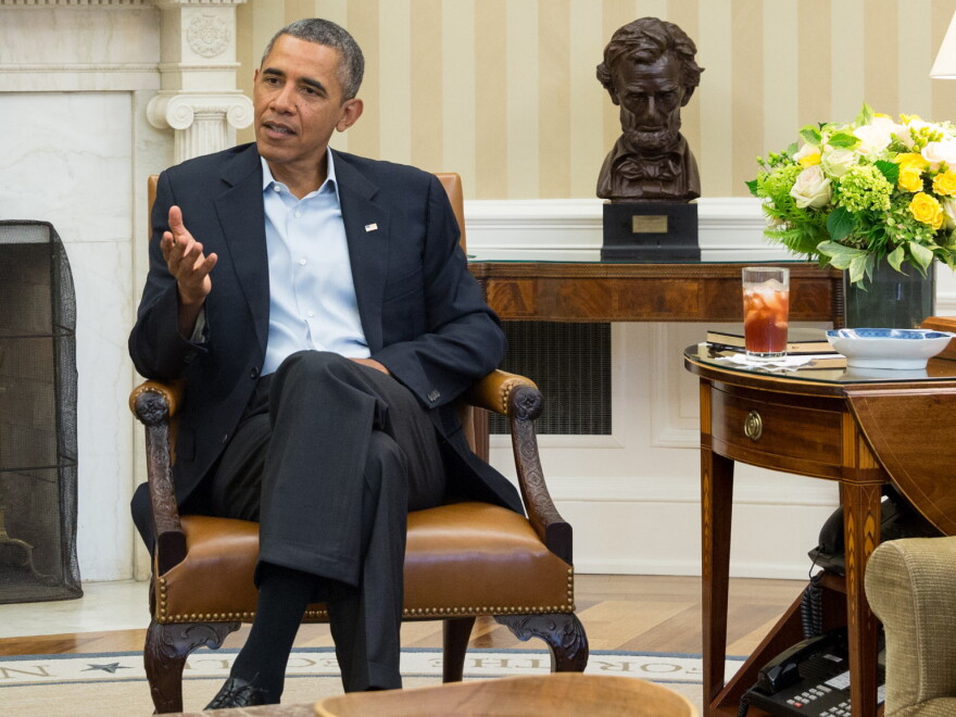 President Obama discusses Syria options in the Oval Office of the White House on Monday.