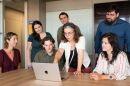 Nev Jones (center) presents information on a laptop to members of her research team at the University of Pittsburgh Path Lab in an undated photo.