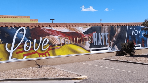 A new mural project at the New Mexico Black Leadership Council’s offices in Southeast Albuquerque. It’s called “Love Trumps Hate” by Noé Barnett.