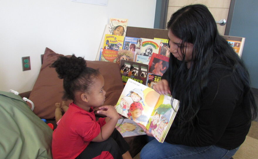 A student and teacher at the Miller Annex Preschool, where mayor Jenny Durkan unveiled her new property tax levy for education.