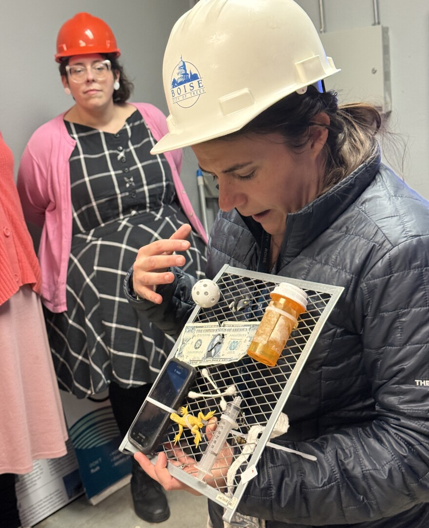 Arabelle Britton, Boise Wastewater Educator, shows "Love at First Flush" tour couples items retrieved from wastewater.