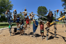 Media camp goers on playground equipment July 2021, Billings Montana.