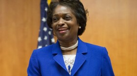 In this Feb. 26, 2015, FCC Commissioner Mignon Clyburn, takes her seat before the start of an FCC open hearing and vote on Net Neutrality in Washington, D.C. (Pablo Martinez Monsivais, file/AP)