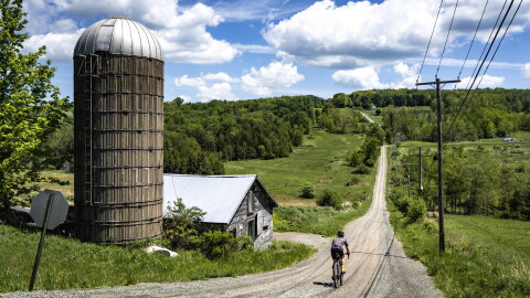 A gravel cyclists rides in Union Dale on one of the Endless Mountain Gravel routes.