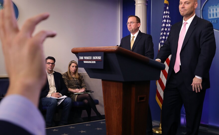 Office of Management and Budget Director Mick Mulvaney (2nd right) and White House Legislative Affairs Director Marc Short (right) hold a news conference about the ongoing partial shutdown of the federal government on Saturday.