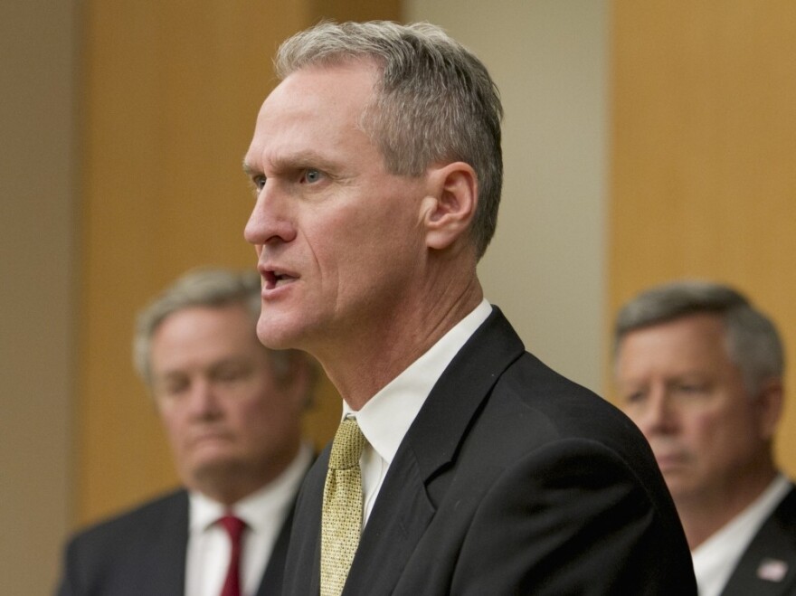 <p>South Dakota Gov. Dennis Daugaard, seen here at a news conference in October, spent seven years in leadership positions at Children's Home Society before becoming the state's governor.</p>
