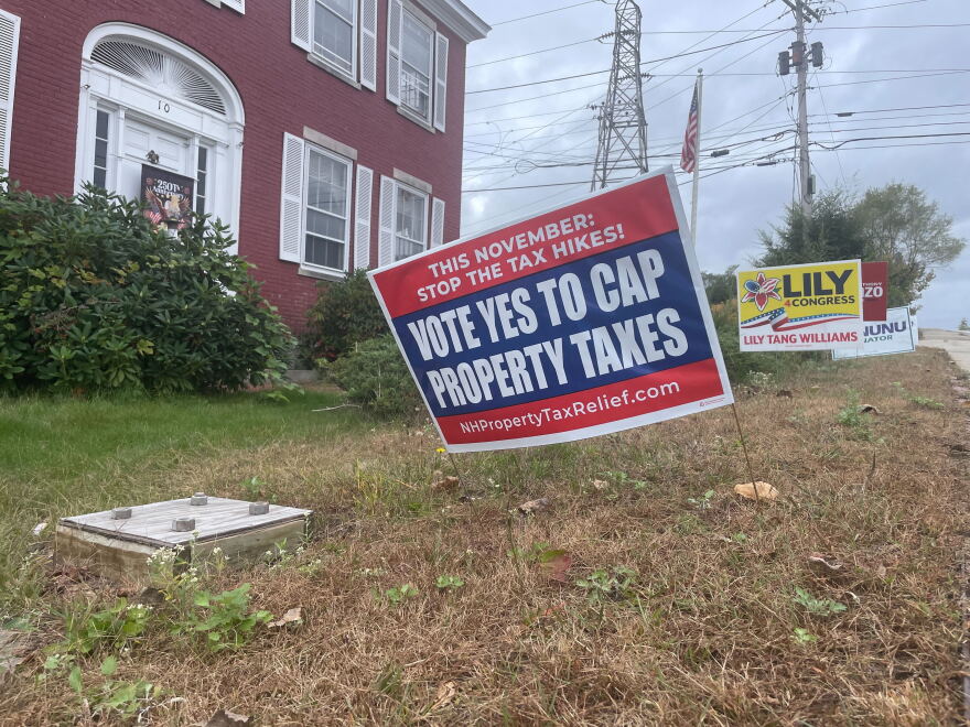A sign outside of the office of the New Hampshire Republican Party in Concord urging voters to vote "yes" on a school tax cap ballot question this fall.