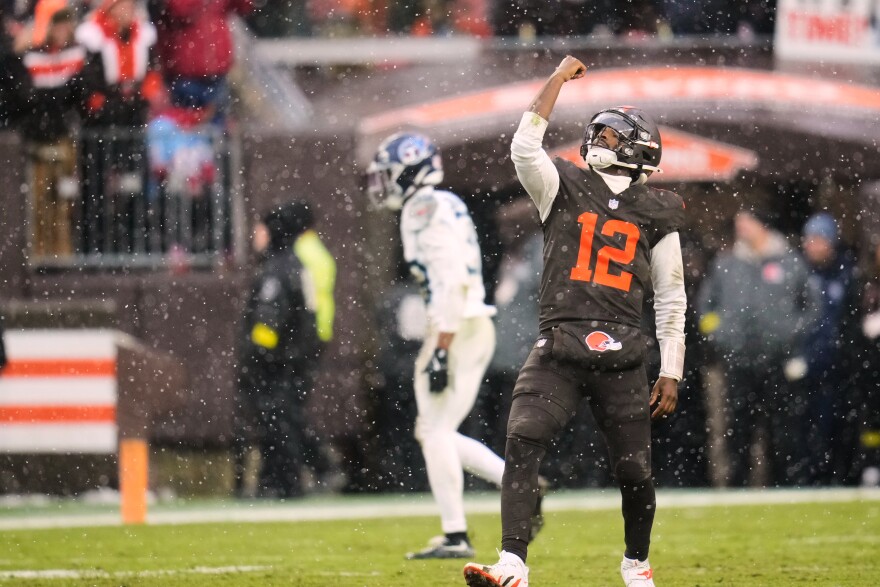 Cleveland Browns quarterback Shedeur Sanders celebrates after throwing a touchdown pass in the first half of an NFL football game against the Tennessee Titans in Cleveland, Sunday, Dec. 7, 2025.  