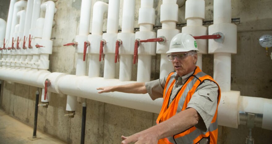 Dan Ellis with Comfortworks Inc. explains the installation of a geothermal heat pump at the Gulfport Energy Corp. headquarters in Oklahoma City. 