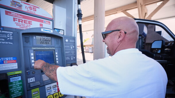 A man in a white T-shirt puts $175 of diesel in his truck at a gas station in Carlsbad, California on Thursday, Sept. 10, 2026.