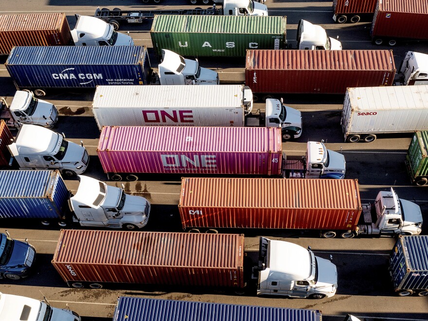 Trucks line up to enter a Port of Oakland shipping terminal on Nov. 10, 2021, in Oakland, Calif. President Joe Biden's administration cleared the way for California's plan to phase out a wide range of diesel-powered trucks, a part of the state's efforts to drastically cut planet-warming emissions and improve air quality in heavy-traffic areas.