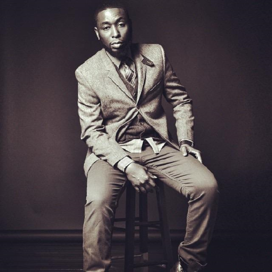 rapper 9th wonder on a stool 