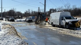 Evansville Water and Sewer crews work to repair a water main in cold January weather