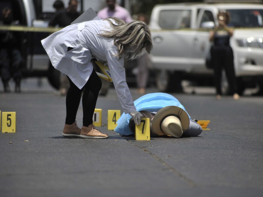 Mexican journalist Javier Valdez lies on the street after he was shot dead in Sinaloa, Mexico, on May 15, 2017. The U.S. State Department is telling Americans to completely avoid five Mexican states because of rising crime and violence.