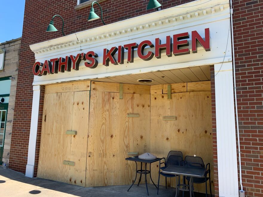 Looters broke the windows of several businesses in Ferguson during protests on Saturday. Although the protests decried violence against black people, black-owned businesses like Cathy's Kitchen were not spared. Volunteers boarded the windows up on May 31.