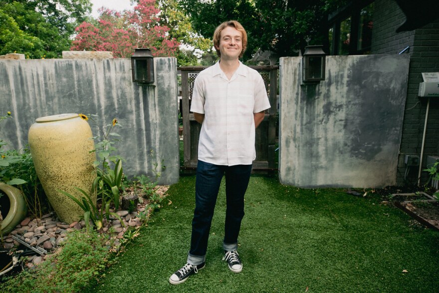 Sloan Struble poses in a yard. 