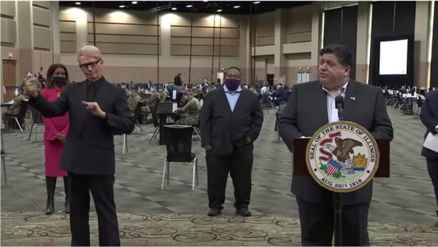 Gov. JB Pritzker holds a news conference after touring a vaccination site in Tinley Park Monday.