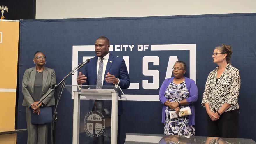 Mayor Monroe Nichols (at lectern) gives a press conference about the fifth excavation at Oaklawn Cemetery on October 14, 2025. Flanked by Brenda Nails-Alford (left), Phoebe Stubblefield (center right) and Kary Stackelbeck (right).