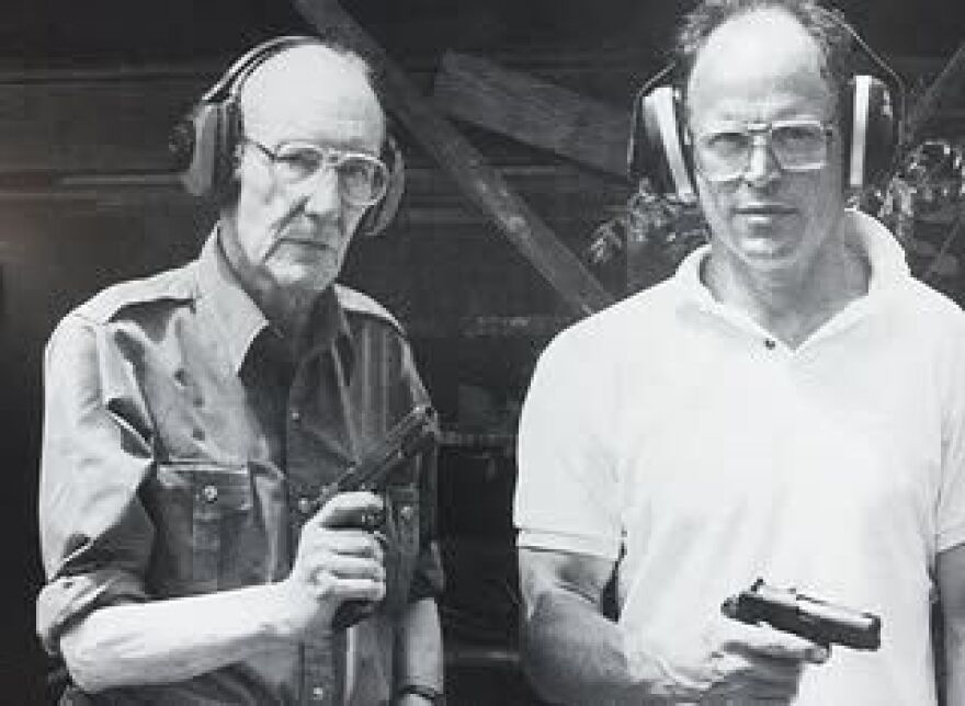 Photo of William S. Burroughs and David Bradshaw at shooting range.