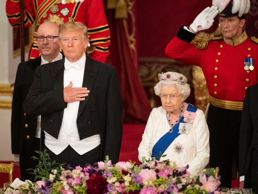Britain's Queen Elizabeth II hosts President Trump for a state banquet in the ballroom at Buckingham Palace in London on Monday, the first day of the U.S. president and first lady's three-day state visit to the U.K.